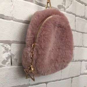 Girls pink fuzzy clutch with gold star charm